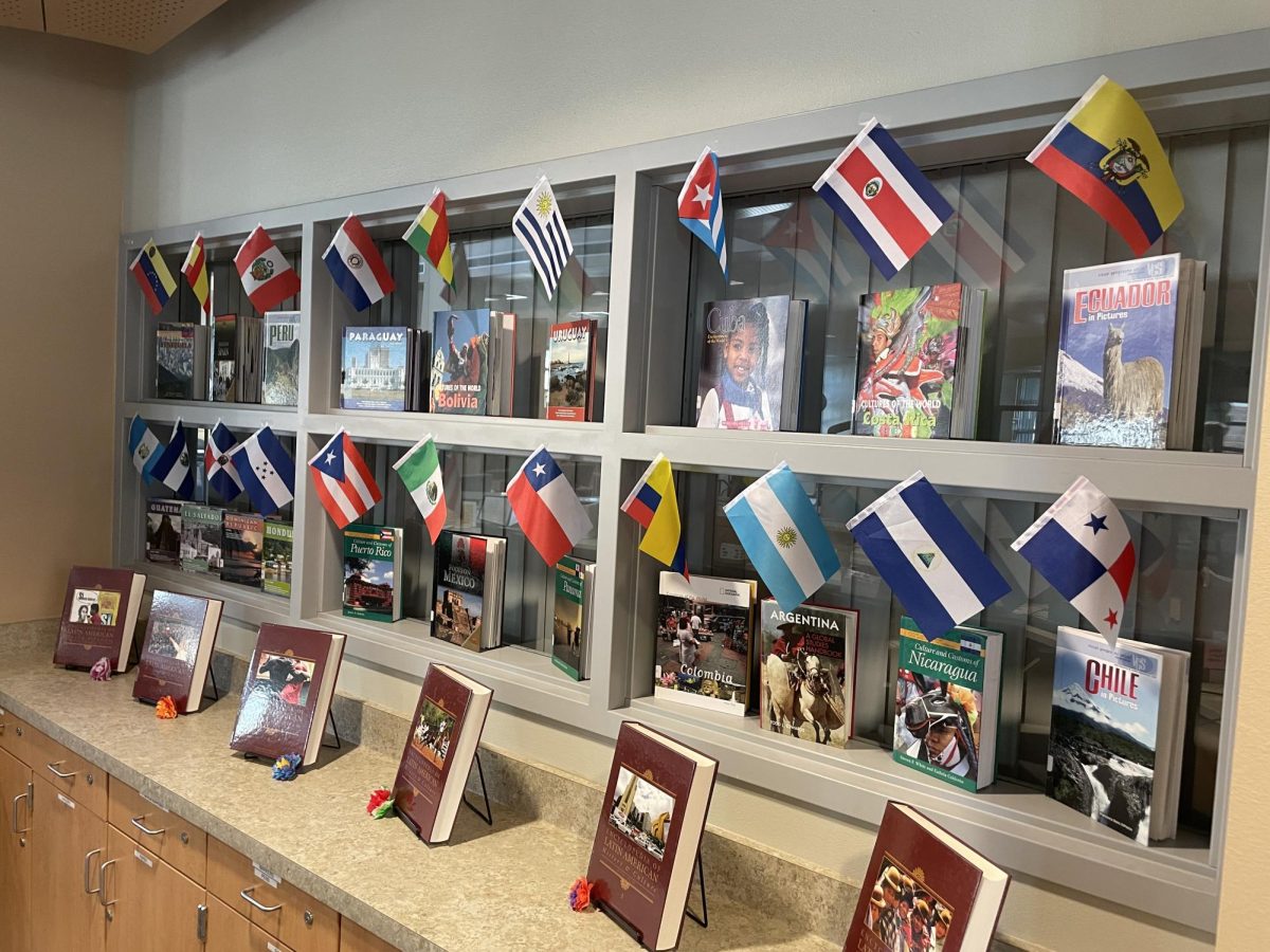 Flags and books on display in the library to commemorate Hispanic Heritage Month. 
