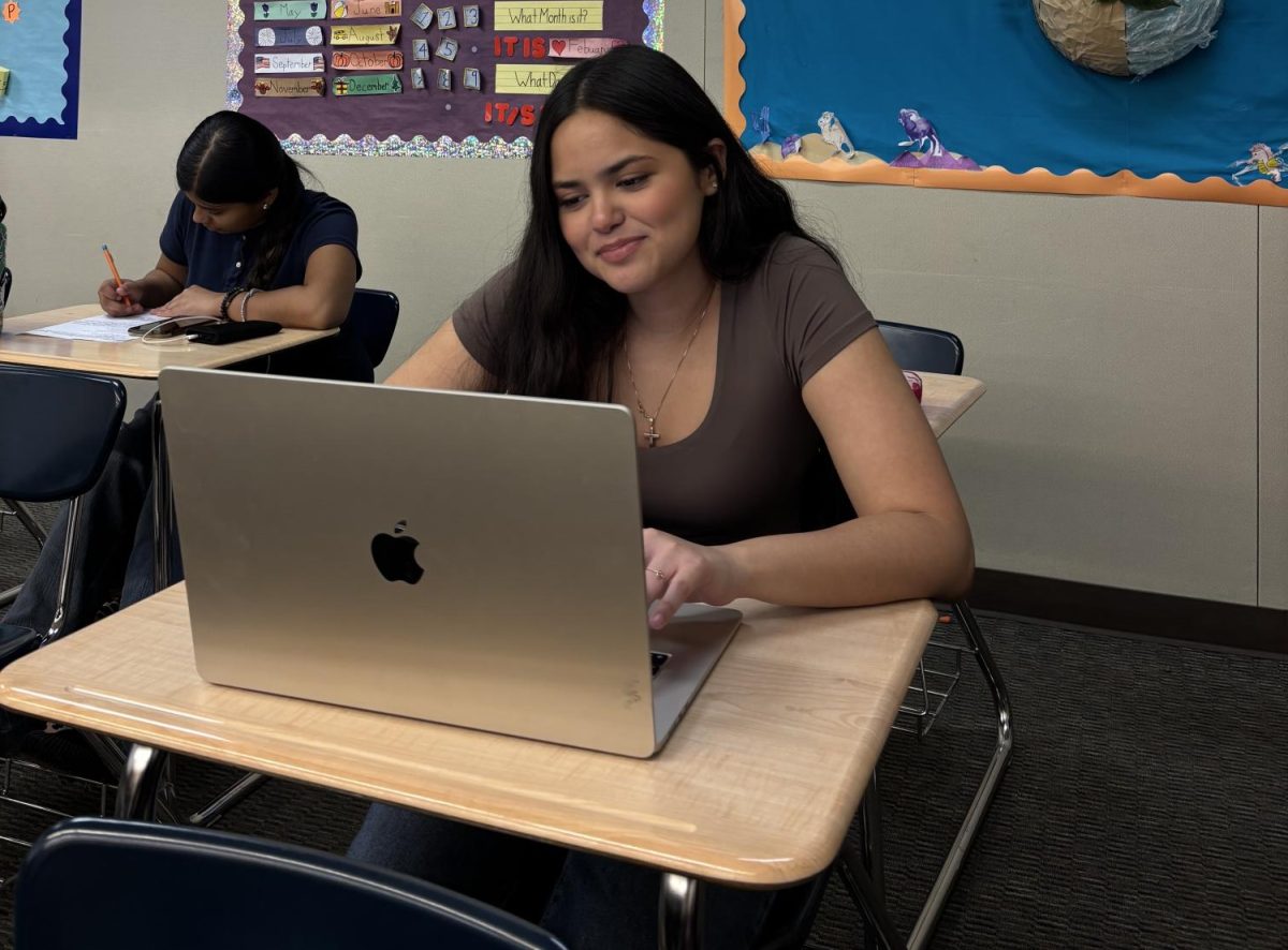 Senior Rihanna Mendoza works on club and school assignment tasks.